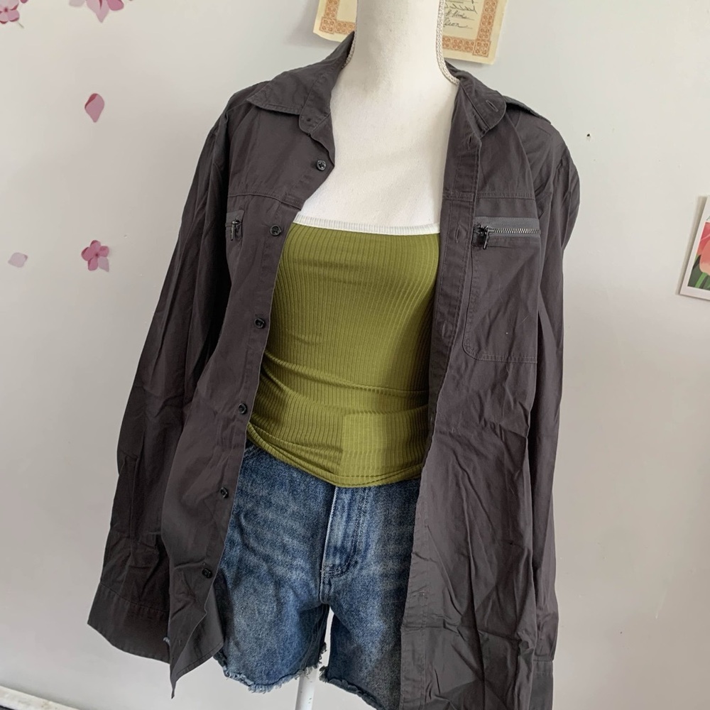Green tank top with jacket and jean shorts